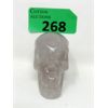 Image 1 : Quartz with Amethyst Hand-Carved Skull - 648 Carats