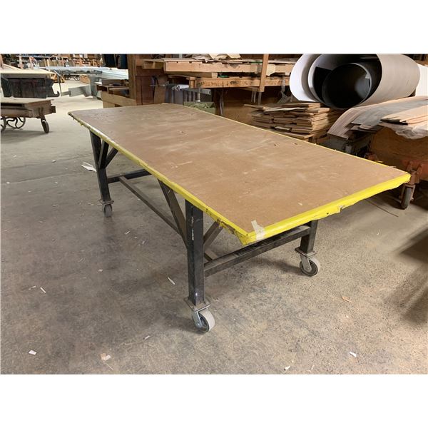 ROLLING WORK TABLE - STEEL FRAME WITH APPROX.8FT X 3 1/2FT PLYWOOD TOP