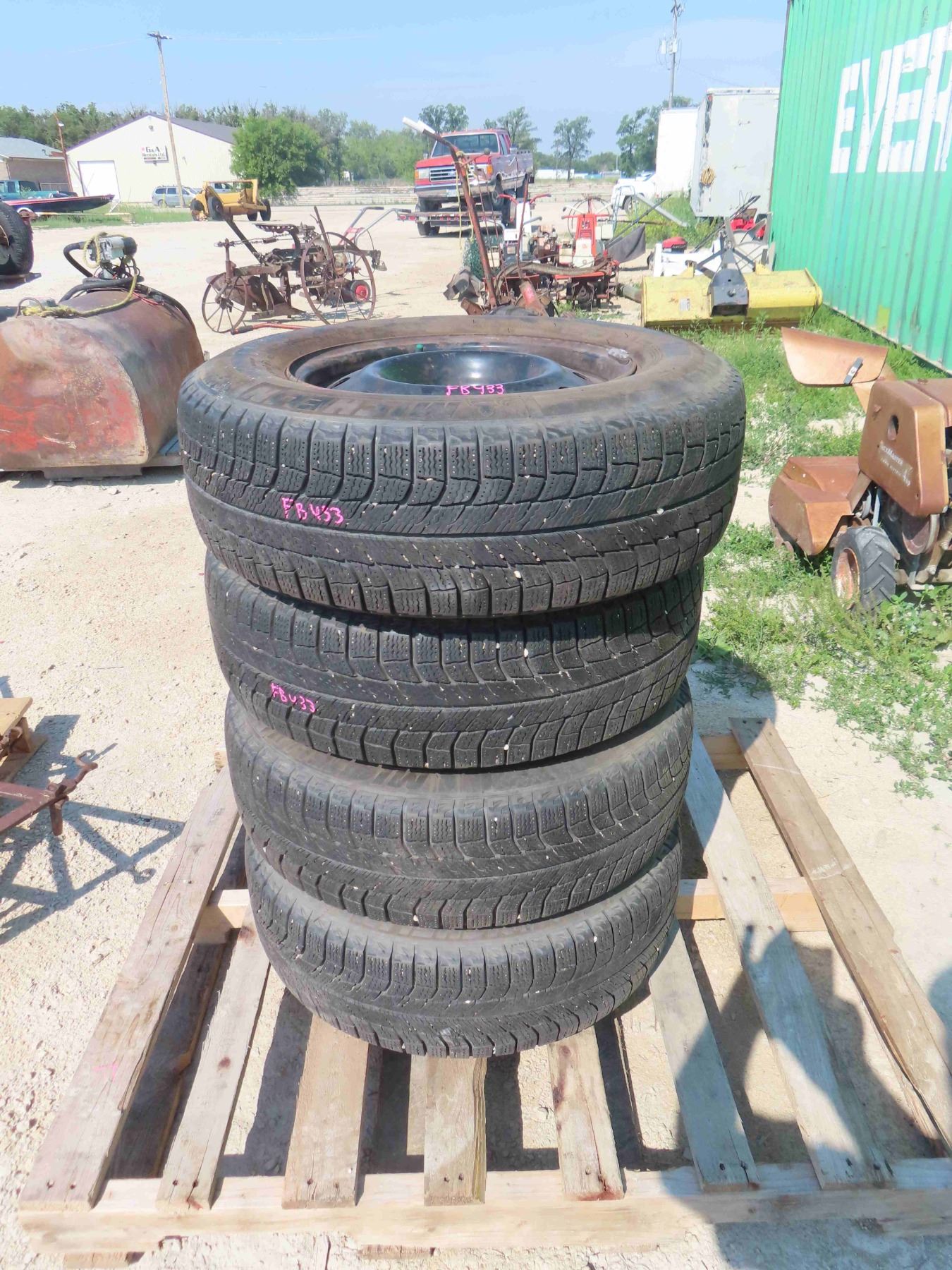 (4) 5 Bolt Rims with Michelin X-Ice 215 / 70 R 15 Tires - Very Good Tread