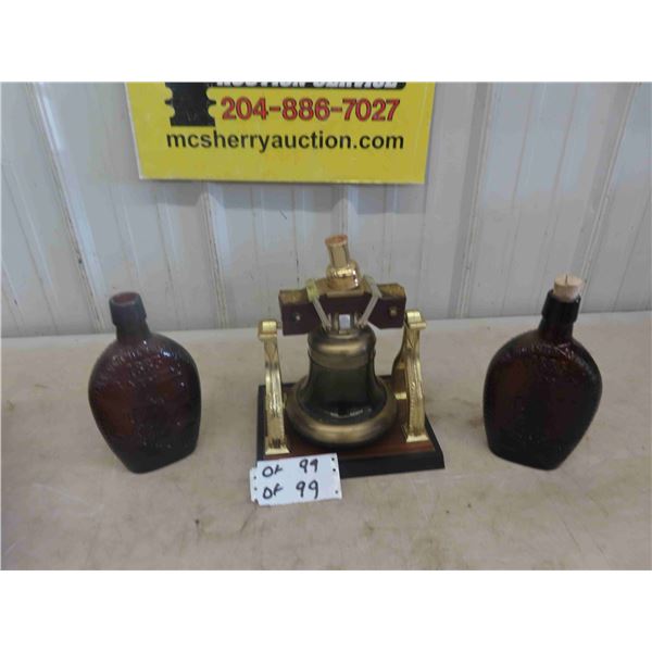 2 Booze Bottles - Embossed ; 1885 with Iron Train + Liberty Bell Decanter
