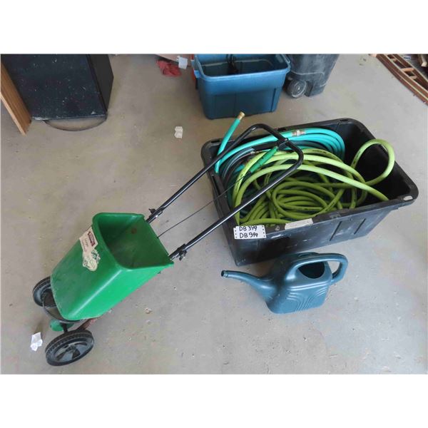 Large Tote with Several Sections of Garden Hose, Watering Can, Garden Center