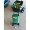 Image 3 : Large Tote with Several Sections of Garden Hose, Watering Can, Garden Center