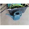 Image 4 : Large Tote with Several Sections of Garden Hose, Watering Can, Garden Center