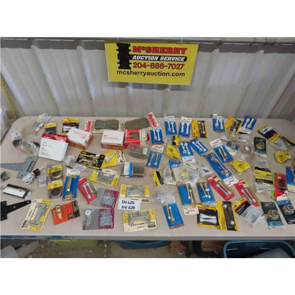 Large Assortment of Packaged Hardware: Hinges, Door Stops, Speaker Wire,  plus more 