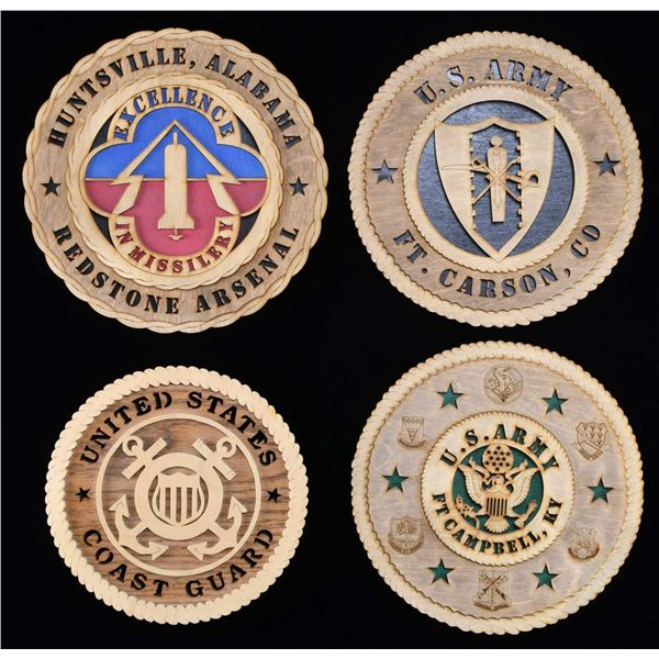4 WOODEN PLAQUES OF US MILITARY EMBLEMS.