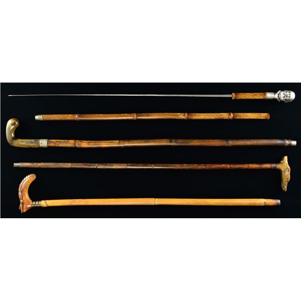 GROUP OF FOUR 19TH CENTURY NOVELTY CANES.