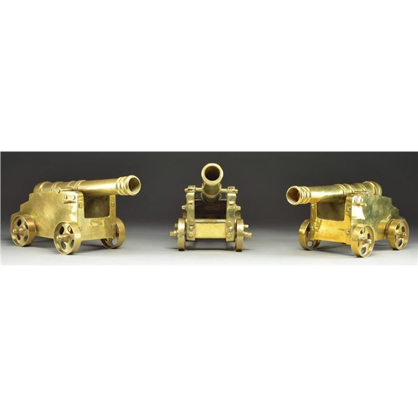 3 DECORATIVE BRASS CANNONS.