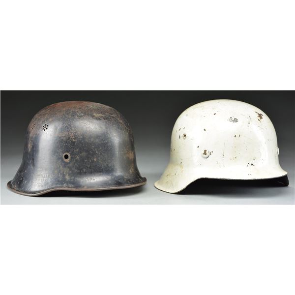 2 WWII GERMAN HELMETS.