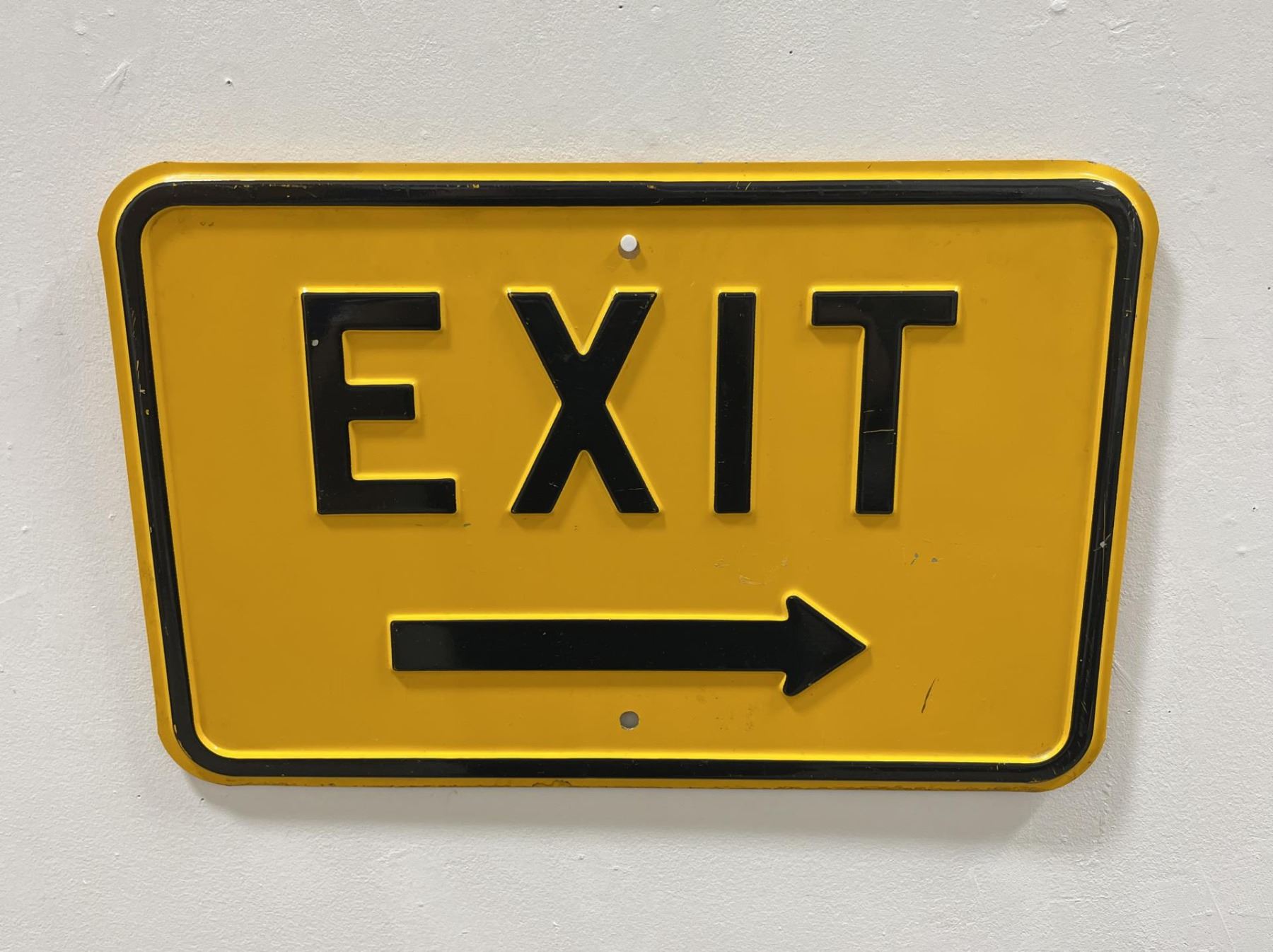 Antique Embossed Yellow Exit Sign