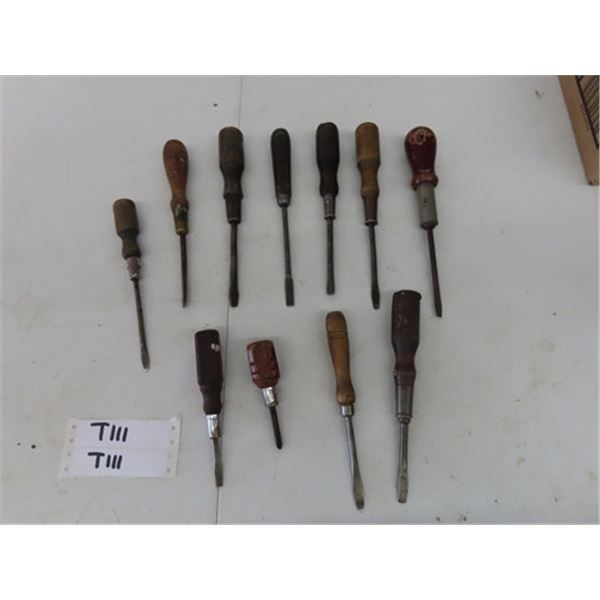 Lot of Vintage Antique Screwdrivers, all but one has a flat head. (It is a Philips) 