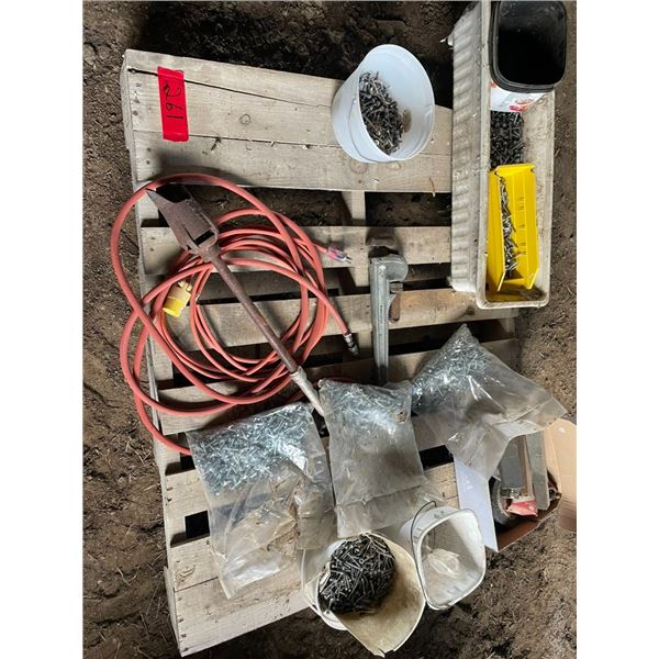 Pallet of sheet metal screws, pipe wrench, tiger torch