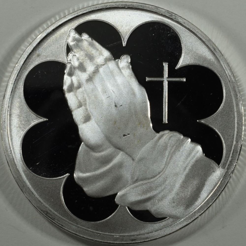 ONE OZ .999 PRAYING HANDS SILVER ROUNDS