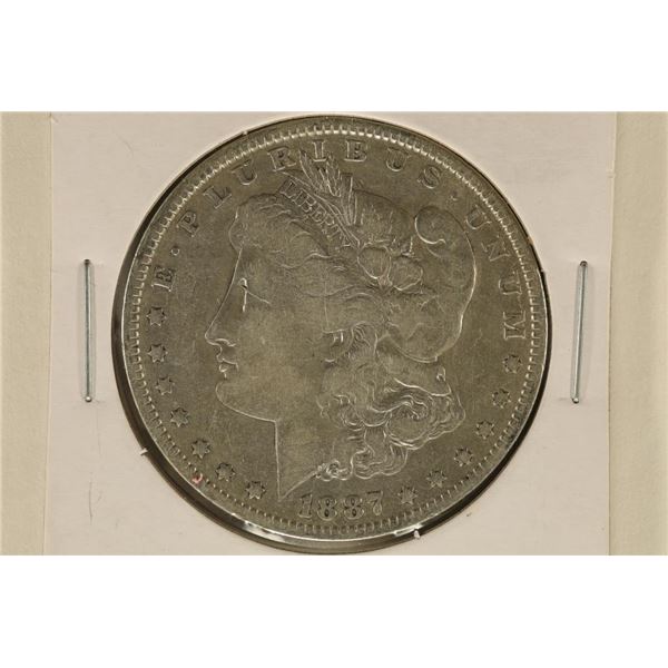 1887-O MORGAN SILVER DOLLAR. REVERSE HAS SOME