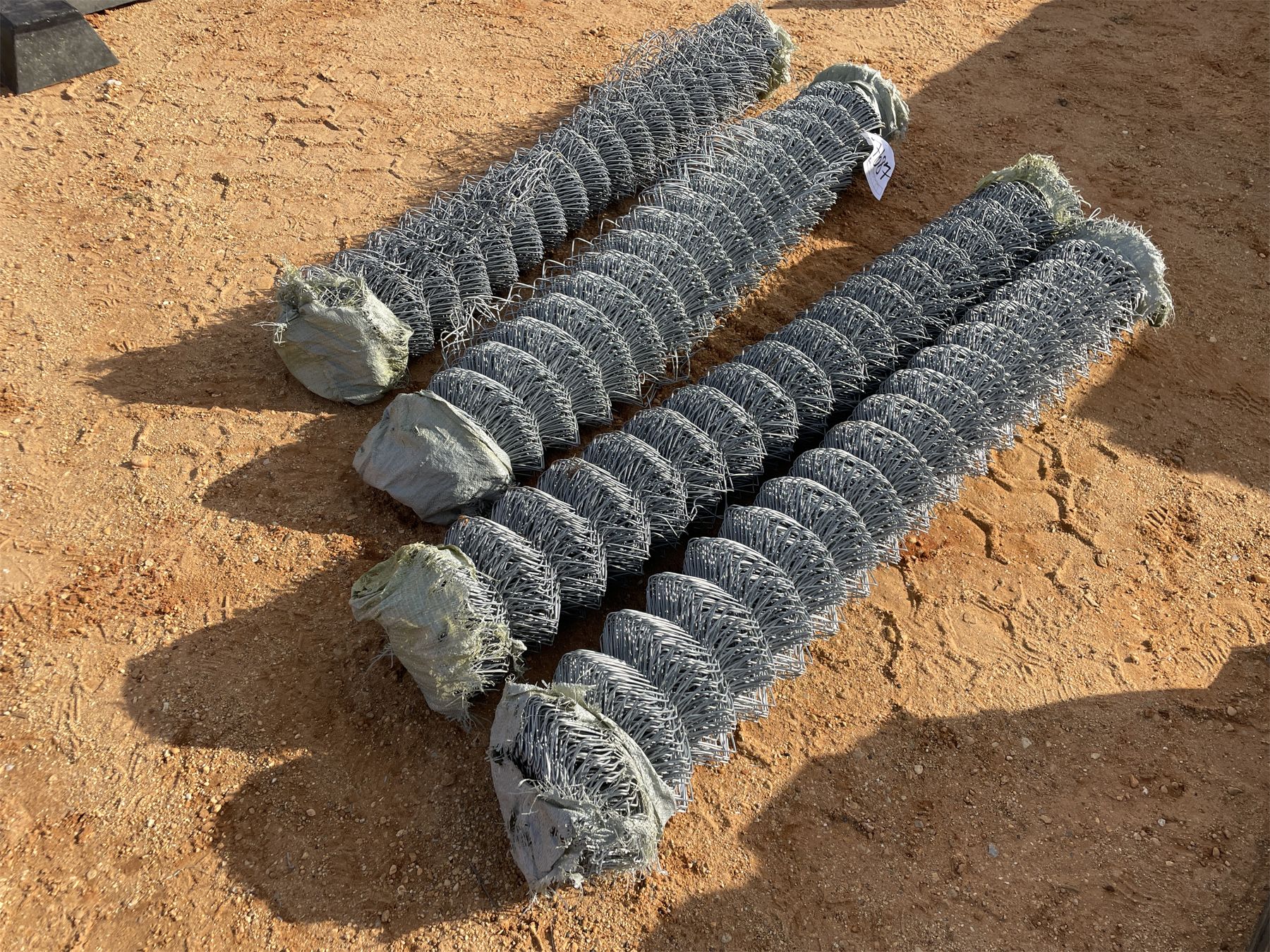 Chain 4 Rols (4) CHAIN LINK FENCE ROLLS - J.M. Wood Auction Company, Inc.