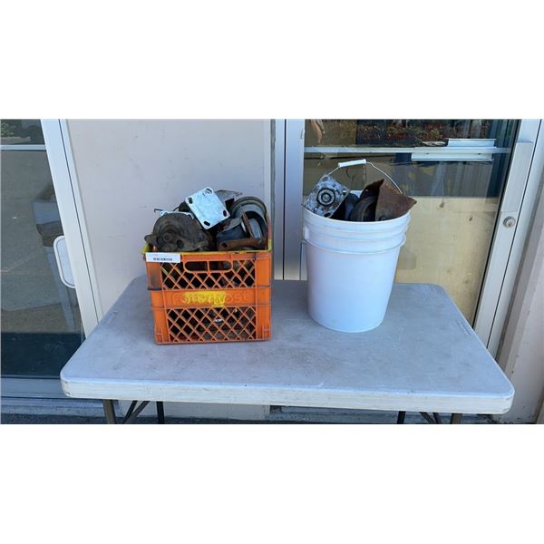 BUCKET AND CRATE OF CASTERS