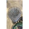 Image 2 : GARDEN HOSE WITH GRID FENCE AND RECYCLING CAN TOPPER