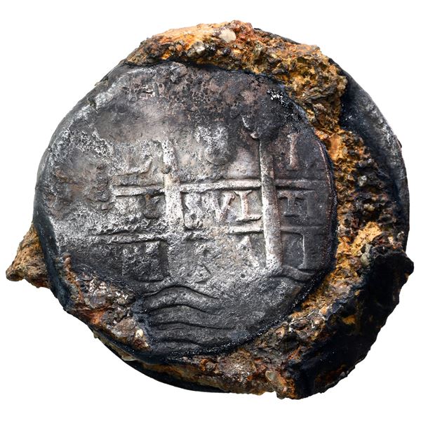 Clump of one Lima, Peru, cob 8 reales, 1694 M, and one English crown, 1696, in matrix, as found.