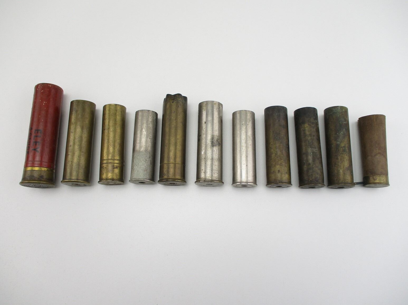 COLLECTIBLE ASSORTED SHOT SHELLS AND BRASS SHOT SHELLS LOT