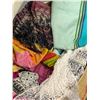 Image 2 : Basket filled w/ assorted African scarves / sheets / cloths / bedding etc