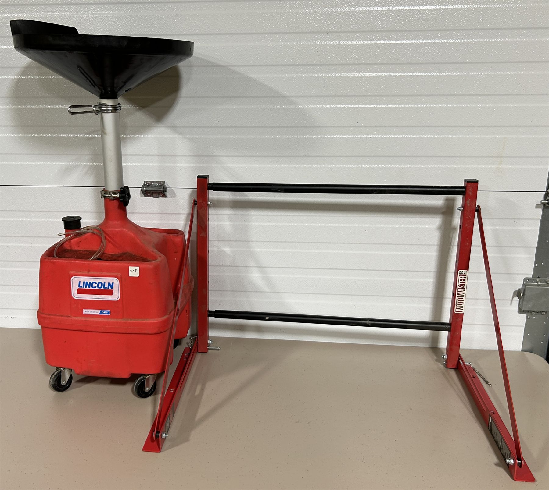 Oil Drain Bucket Rack LOT OF 2 - OIL DRAIN BUCKET AND WALL MOUNT TIRE RACK.