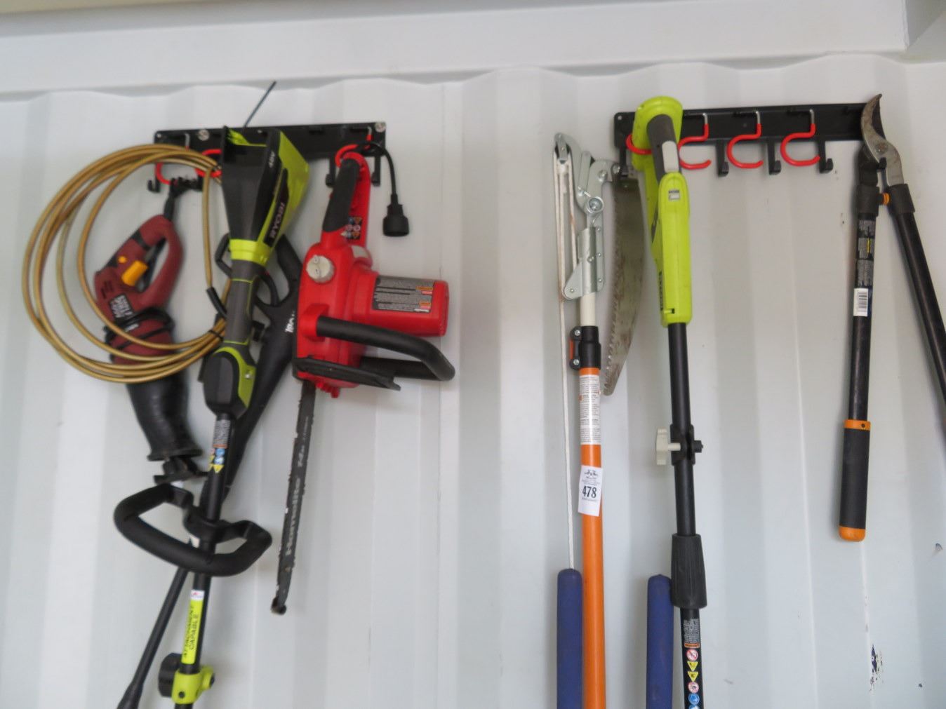 Yard Tools On Wall, Ryobi Trimmer, Chainsaw Post Hole Digger