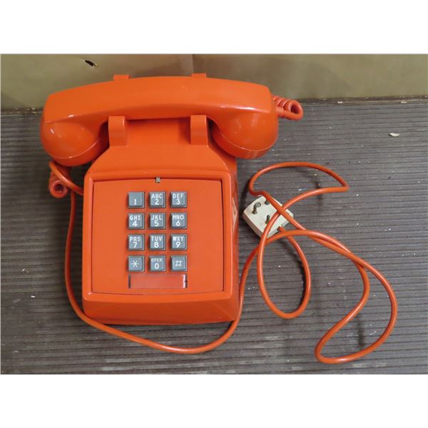 Vintage bright orange Phone with unique plug