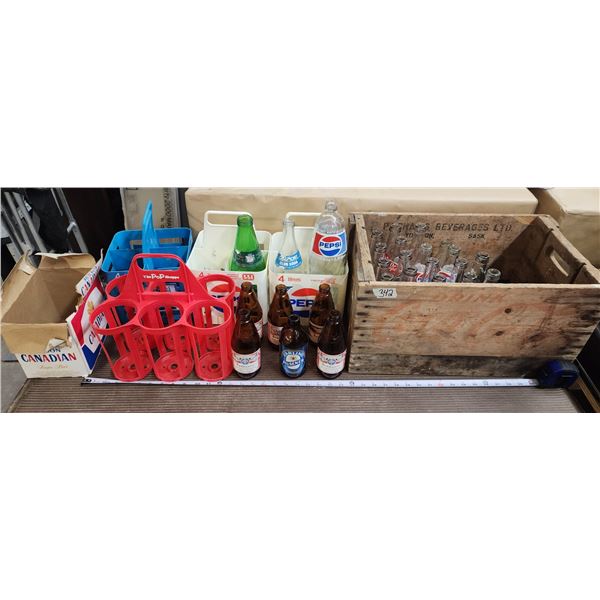 Large collection of assorted bottles and drink cases