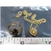 Image 1 : Gold ring stamped 10K with black stone – (stone chipped & Authenticity unchecked) & delicate necklac