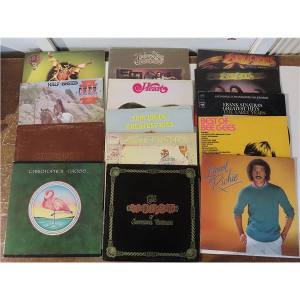 14 Vinyl Records including: Elton John, The Bee Gee’s, Dream boat Annie, Cher, etc.