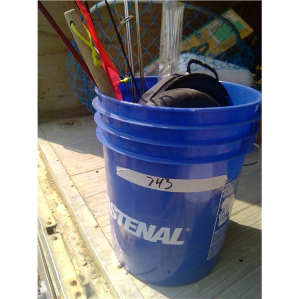 bucket of ice fishing/campfire supplies