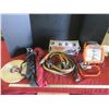 Image 1 : work light, 2 camp stools, car vacuum, flashlight, jumper cables and roll of wooden strap