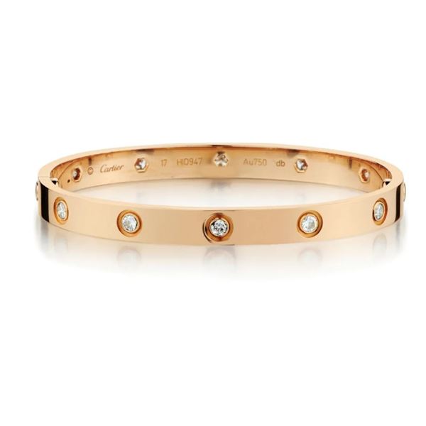 CARTIER "LOVE COLLECTION" IN 18KT ROSE GOLD WITH 10 DIAMONDS. SIZE 17.