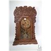 Image 1 : Waterbury oak cased gingerbread clock with chiming movement and decorative pendulum, circa 1900, wor