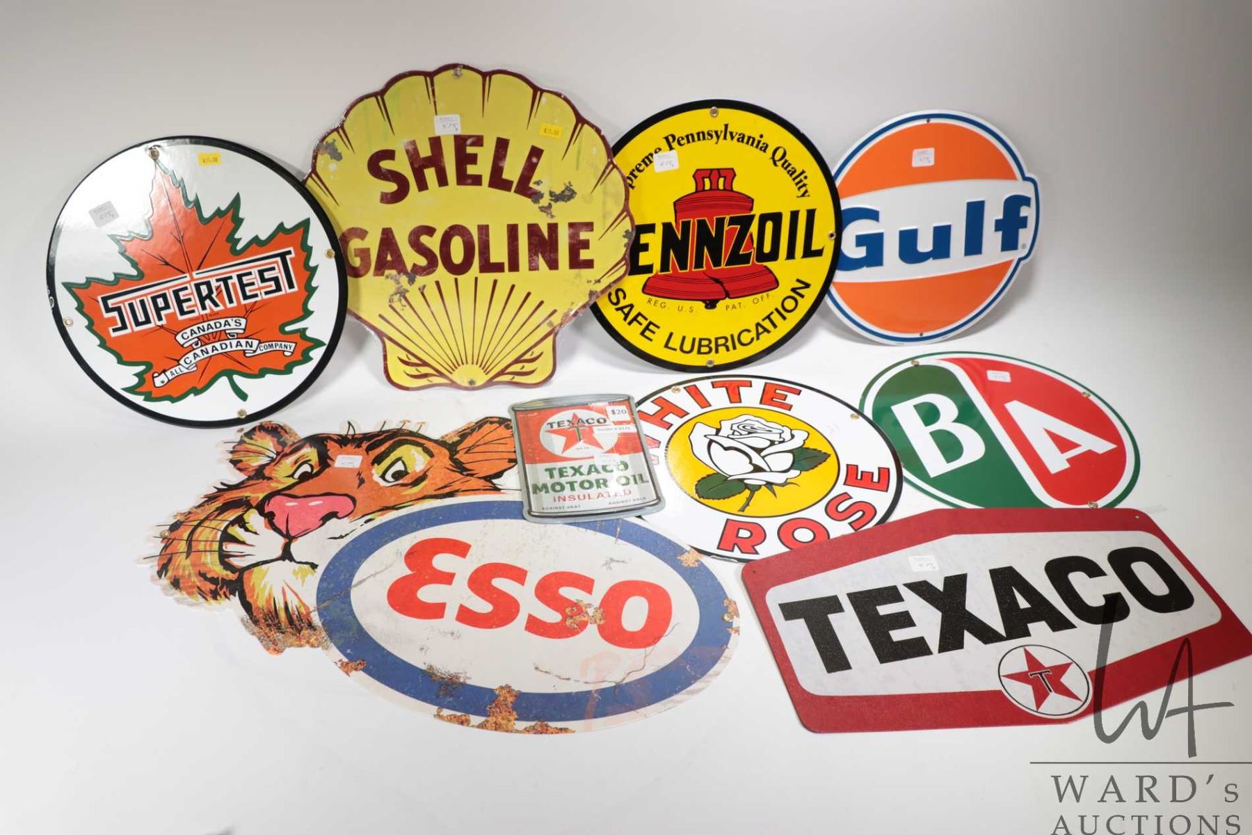 Selection of re-issued oil and gas signs including ESSO, SUPER TEST ...