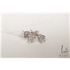 Image 1 : Pair of 14kt yellow gold and diamond solitaire earrings. .25cts total diamond weight