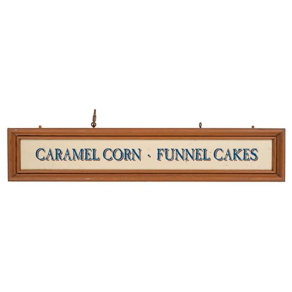 A Disney Parks Caramel Corn & Funnel Cakes Sign.