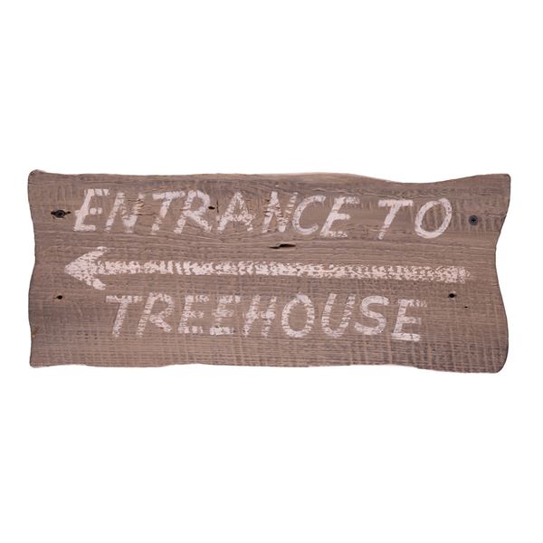 A Tom and Huck's Treehouse Entrance Sign.