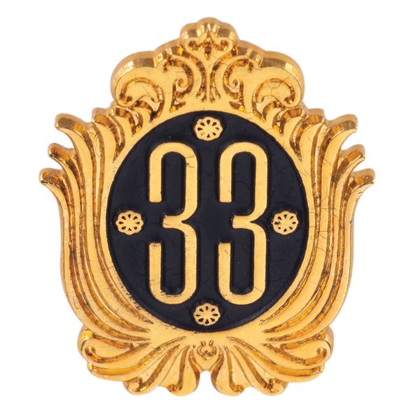 A Club 33 Gold-Finish Souvenir Pin.