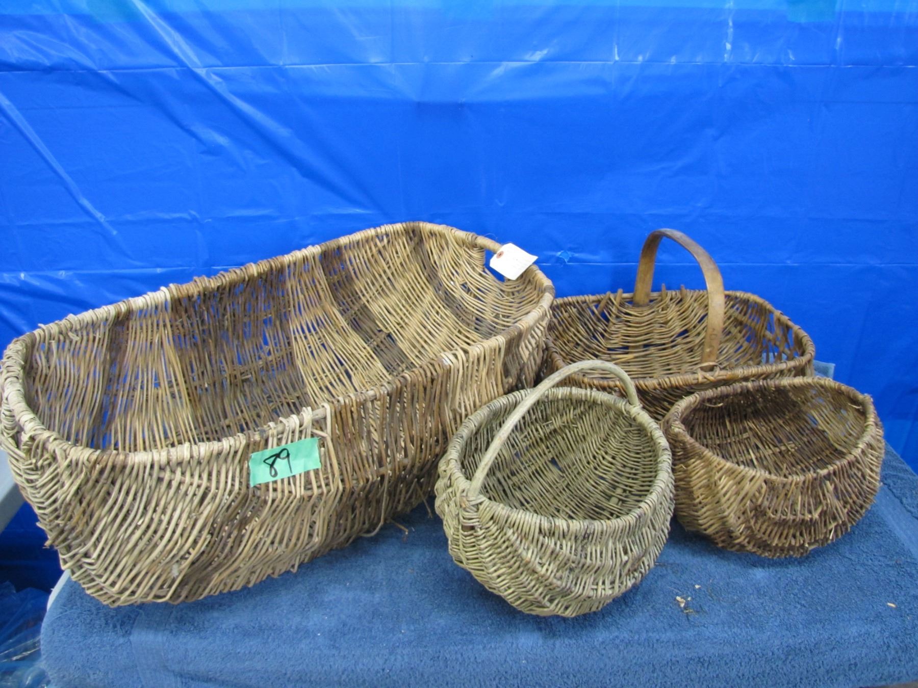 Set of four various woven willow baskets
