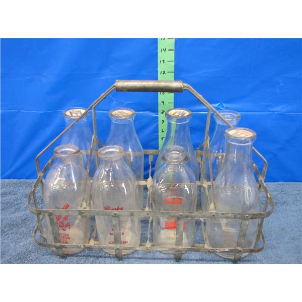 Glass milk jugs and metal carrier