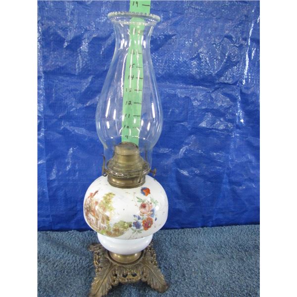 Vintage oil lamp with cast base and painted flowers and house