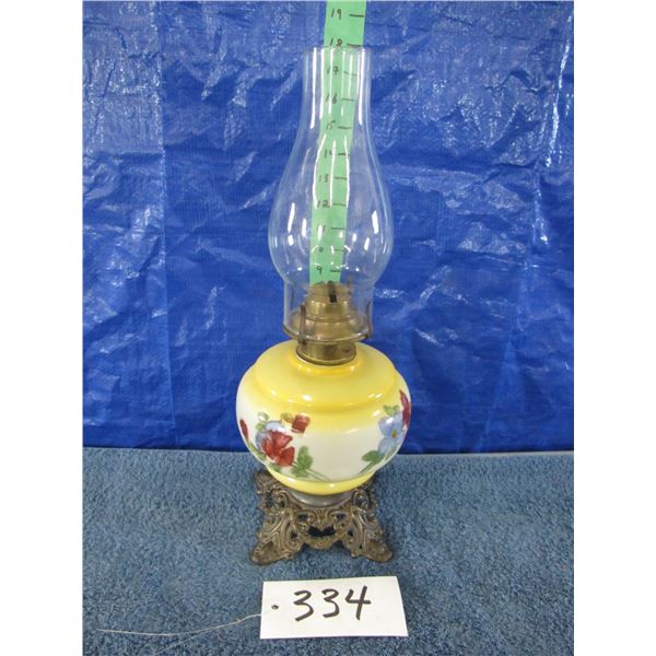 Vintage oil lamp painted with Yellow accents and blue and red flowers & cast base