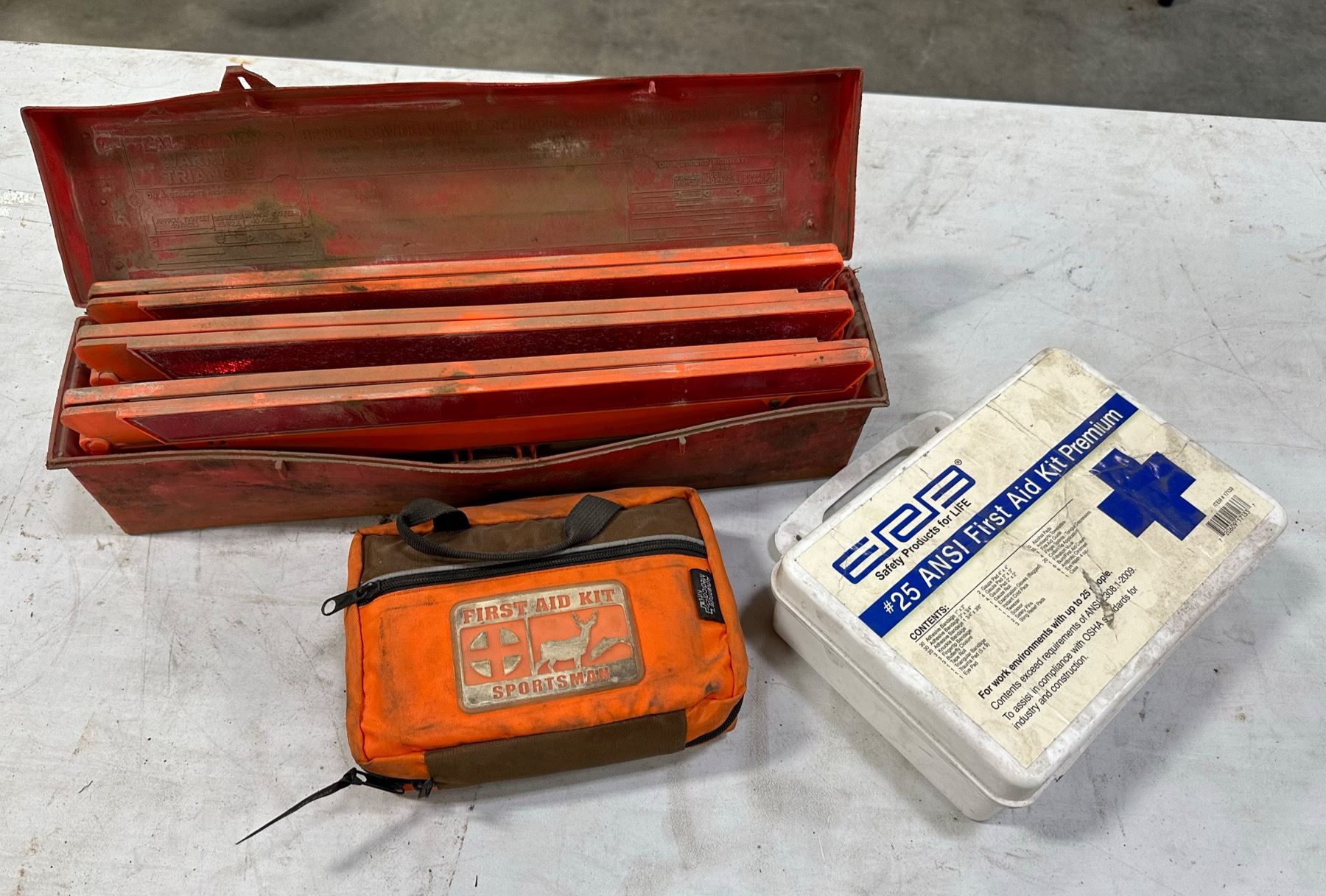 ROADSIDE SAFETY TRIANGLES AND FIRST AID KITS