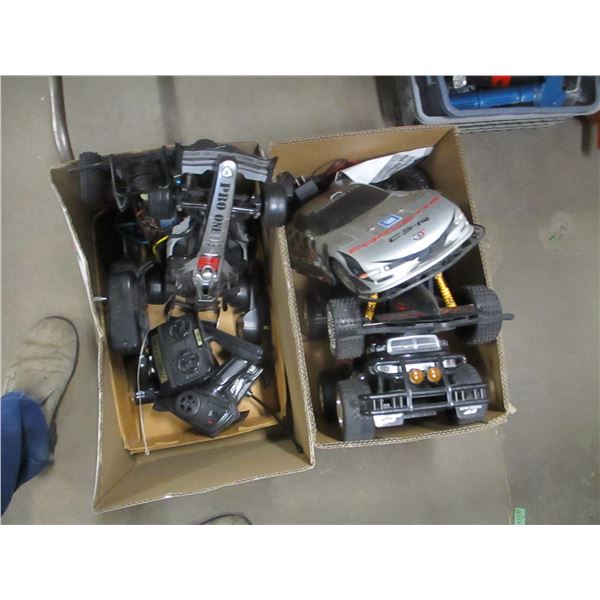 2 BOXES C/W REMOTE TRUCKS (AS IS)"