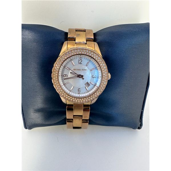 MICHAEL KORS womans watch.  Works.  Some wear on the band - see photos