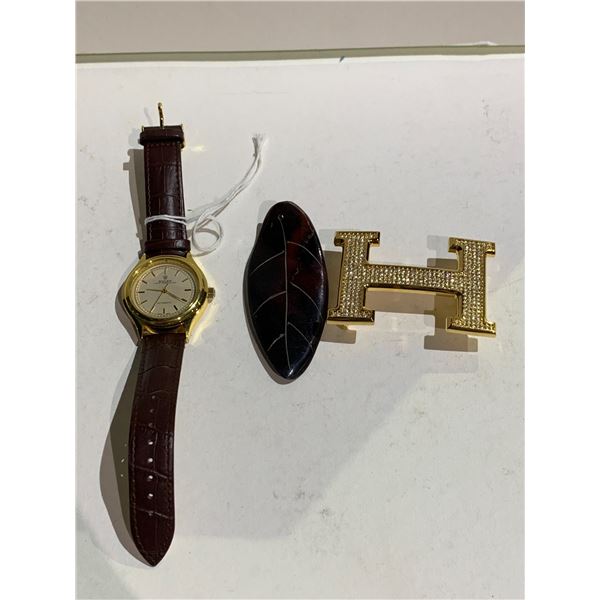 MECHANICAL WRIST WATCH AND BELT BUCKLE