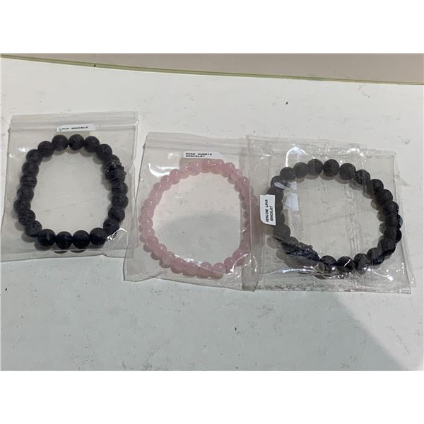 2 LAVA BEAD BRACELETS AND 1 ROSE QUARTZ BRACELET