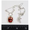 Image 1 : RHINESTONE PENDANT CENTERED BY ORANGE STONE ON