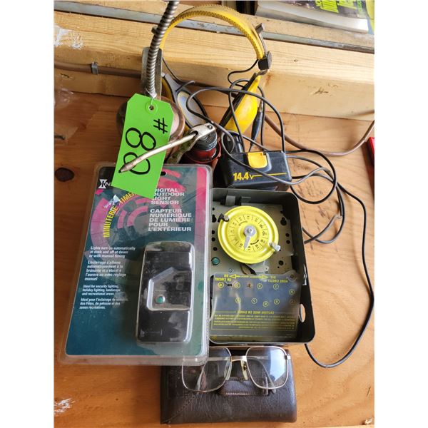 Timer, Oil cans, battery and Stereo headphones and misc. parts