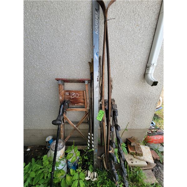Ski rack, skis, ski poles, ladder, weed eater, 6-cans of paint